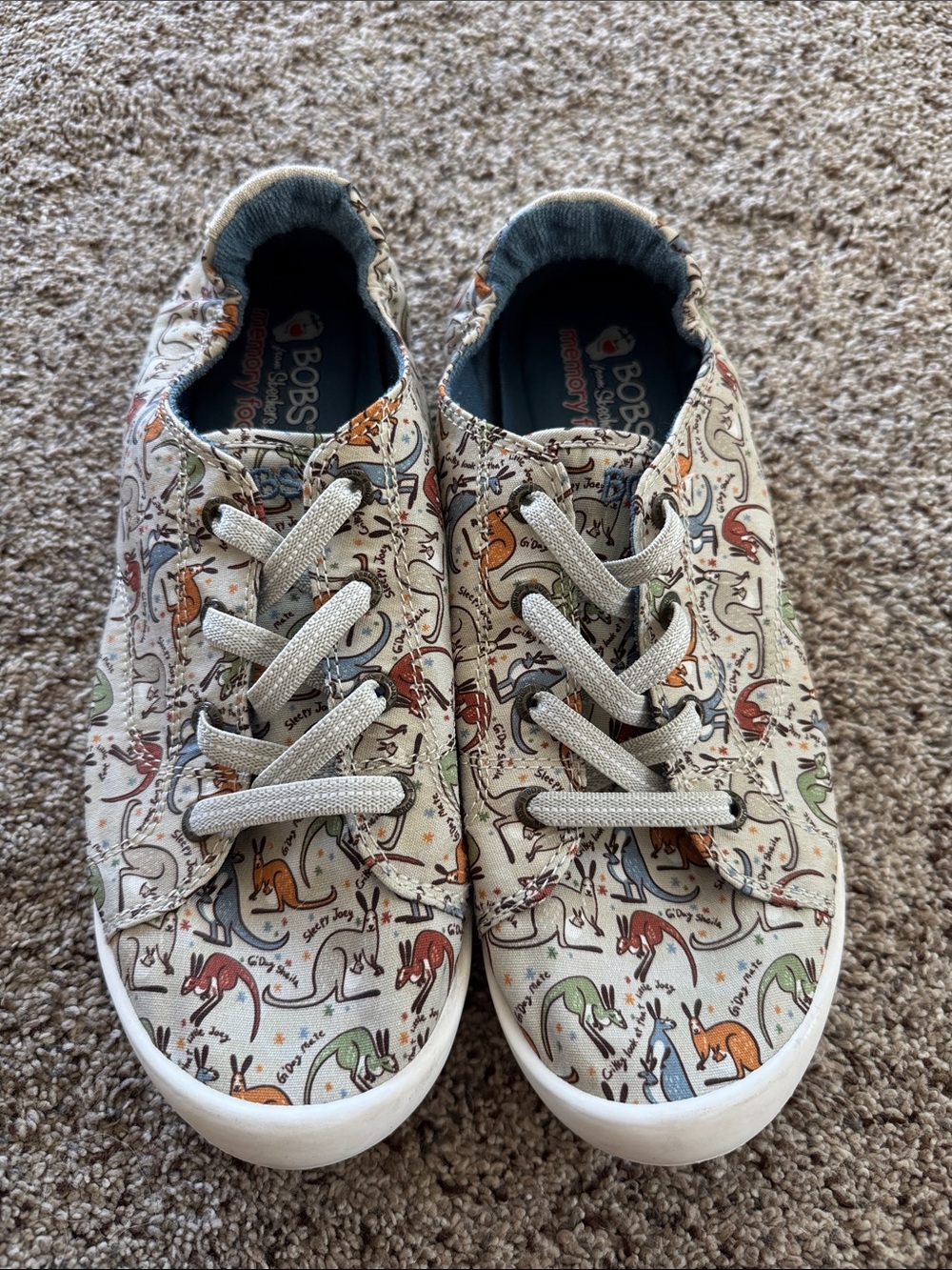 Skechers Canvas Slip-On Sneakers in Cream with Multi-Color Kangaroo Print